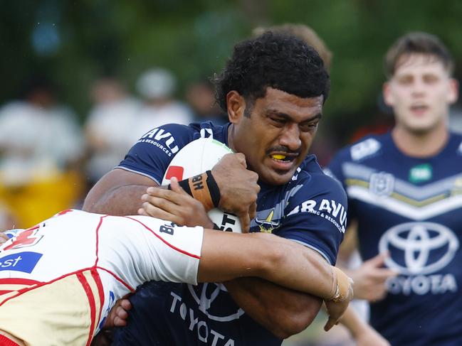 Cowboys' Taniela Sadrugu is tackled in the NRL pre season match between the North Queensland Cowboys and the Redcliffe Dolphins at Barlow Park Picture: Brendan Radke