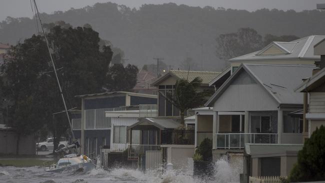 A boat crashes into a suburban street in Belmont. Picture: Owen Hammond.