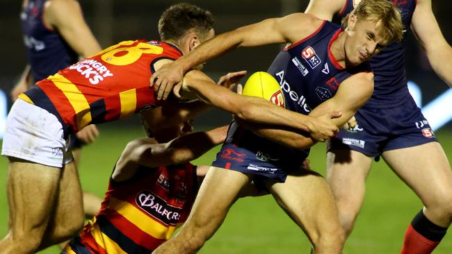 Norwood’s Jacob Kennerley is gang-tackled against Adelaide at The Parade on Friday night.. Picture: Kelly Barnes.