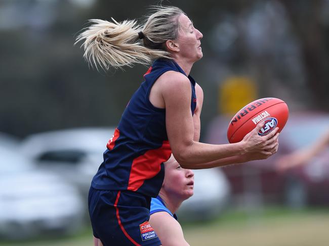 VFL (women's) football: Diamond Creek v VU Western Spurs at Plenty War Memorial Park, Plenty. Western Spurs in light blue jumpers.  No 4 for Diamond Creek Tanya Hetherington marks. Picture: Lawrence Pinder