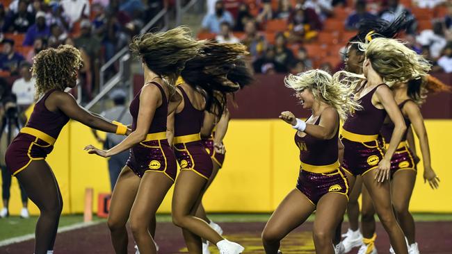 Washington Football Team cheerleaders performing during the pre-season NFL game against the Baltimore Ravens. Photo by Mark Goldman/Icon Sportswire via Getty Images