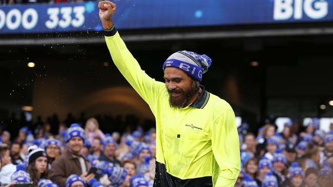 Victory: Rioli is wet, chilled to the bone and triumphant. Picture: AAP Image/Daniel Pockett