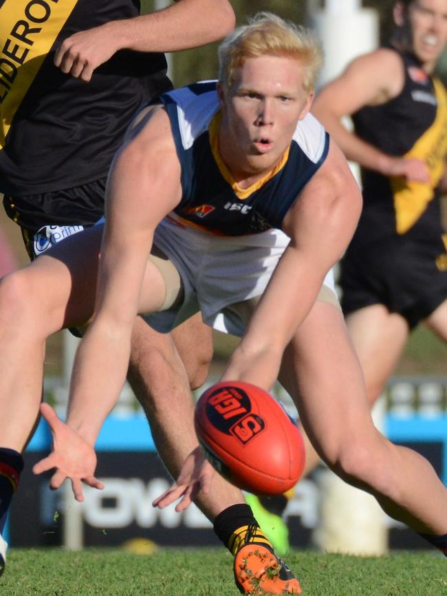 Adelaide's Elliott Himmelberg scoops up the ball in the SANFL. Picture: AAP Image/ Brenton Edwards