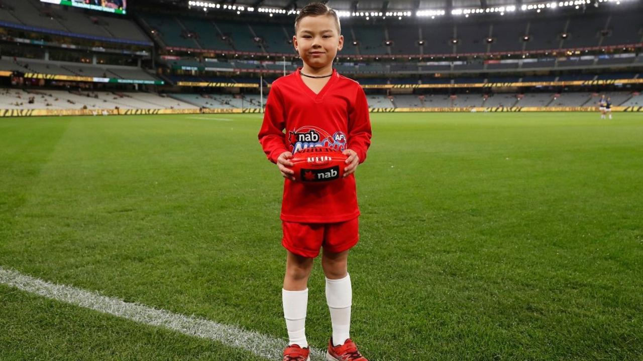 Jaguar Bogert, 6, was named Auskicker of the Week in round eight and will present a premiership medal to a player from the winning team on Grand Final Day. Picture: AFL Photos