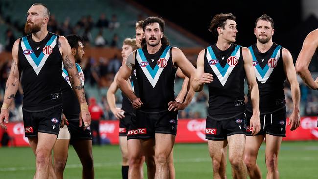 ADELAIDE, AUSTRALIA - SEPTEMBER 05: Power players look dejected after a loss during the 2024 AFL Second Qualifying Final match between the Port Adelaide Power and the Geelong Cats at Adelaide Oval on September 05, 2024 in Adelaide, Australia. (Photo by Michael Willson/AFL Photos via Getty Images)