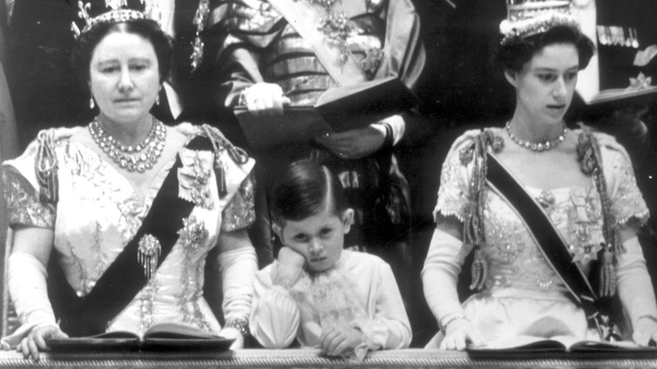 Prince Charles, standing between his grandmother the Queen Mother and his aunt Princess Margaret, created history at the ceremony as the first child to witness his mother’s coronation but seemed less than impressed.