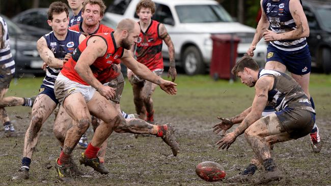 RDFL footy: Macedon V Romsey. The ground was a mud pit from the centre bounce to the goal square. Picture: Adam Elwood