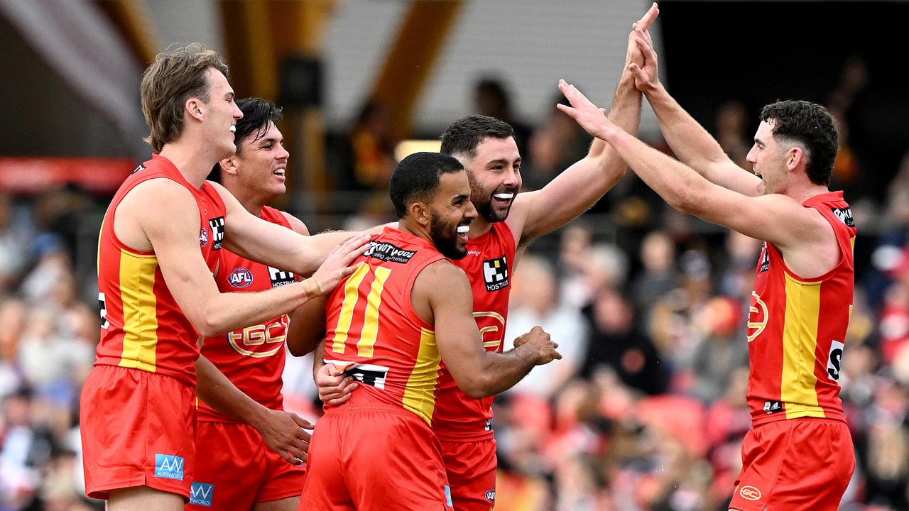 Suns players celebrate a goal. Picture: Bradley Kanaris/Getty Images.