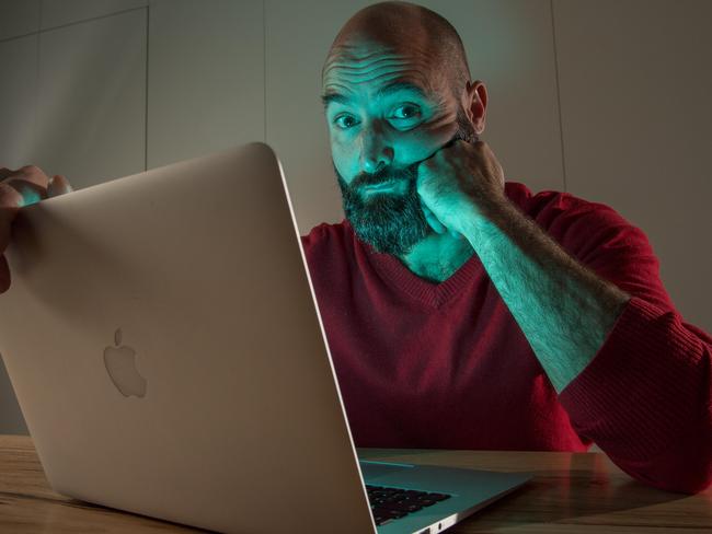 Frustrated Martin Bucher says he has had no home internet service for his laptop for the last four weeks and that since hooking up to the NBN it has been a "total nightmare". Picture: Jake Nowakowski