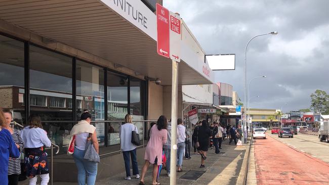 People had to wait in a two-hour queue outside the Centrelink office at Brookvale so they could sign on for Federal Government financial assistance after losing their jobs because of COVID-19 shutdown. Picture: Jim O'Rourke