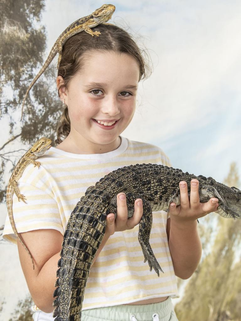 Reptiles galore for Ivy Cheyne at Reptile Kingdom Australia on day 3 of the Toowoomba Royal Show. Sunday, March 27, 2022. Picture: Nev Madsen.