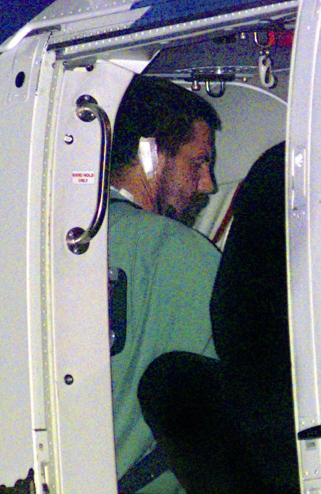 Robert Paul Long in a helicopter after the arson attack on Palace Backpackers Hostel in Childers that left 15 dead, headed for Arthur Gorrie Prison in Brisbane on June 2000. Picture: Steve Pohlner