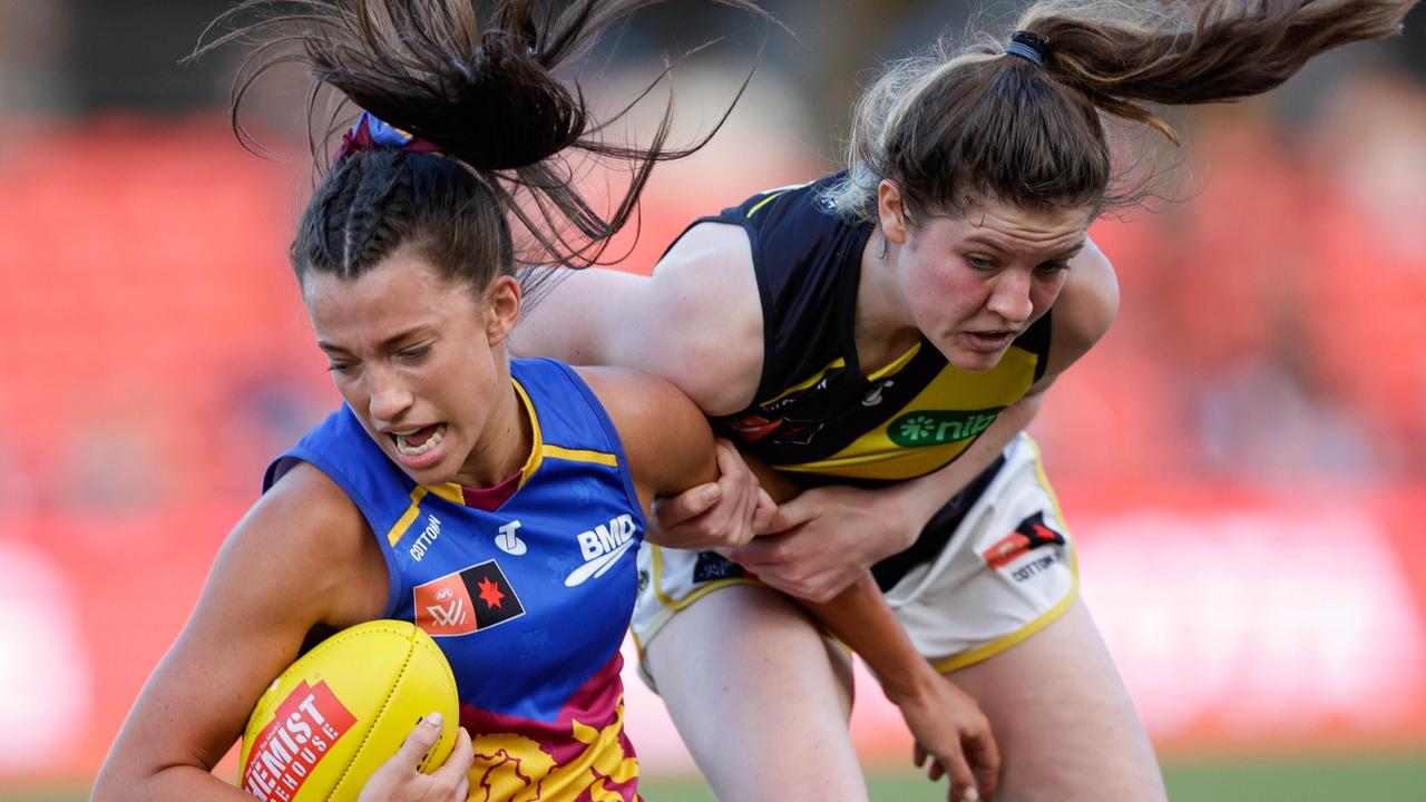 Jade Ellenger is tackled by her Richmond opponent. Picture: Russell Freeman/AFL Photos via Getty Images