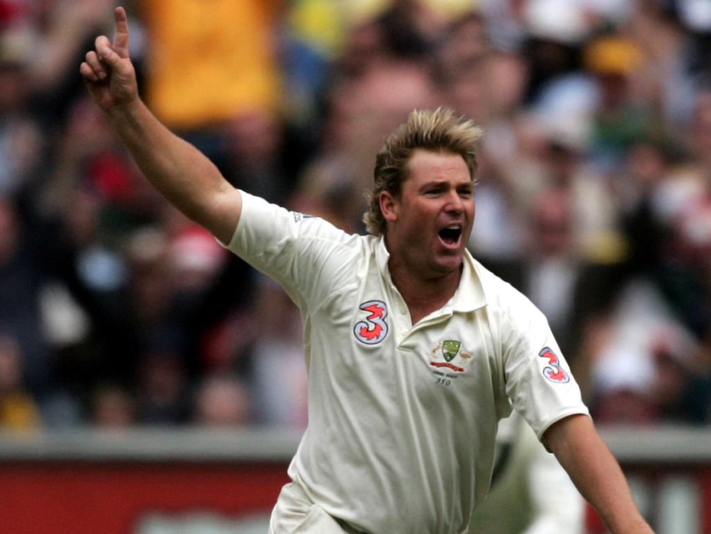 Warne sets off on a victory lap after taking his 700th Test wicket on day one of the 2006 Boxing Day Test. Picture: Stuart McEvoy