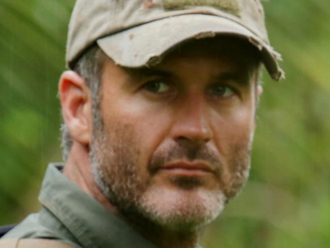 Former US Navy SEAL Joel Lambert trekking through the Panama forest in TV series Manhunt