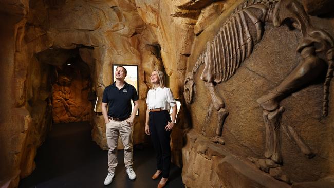 Cairns Aquarium has opened a new attraction, the Riversleigh Fossil Tour, in time for the busy Christmas holiday period. Cairns Aquarium chief executive Daniel Leipnik and Assistant Tourism Minister Bree James inspect a large prehistoric wombat fossil at the new exhibit, one of four Gondwanna-era fossil recreations on display to the public. Picture: Brendan Radke