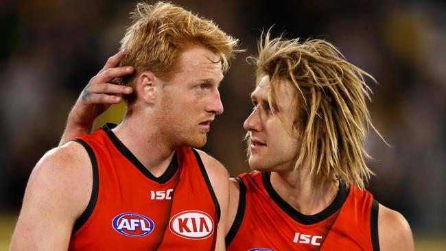 Aaron Francis (left) with Bombers skipper Dyson Heppell. Pic: Getty Images