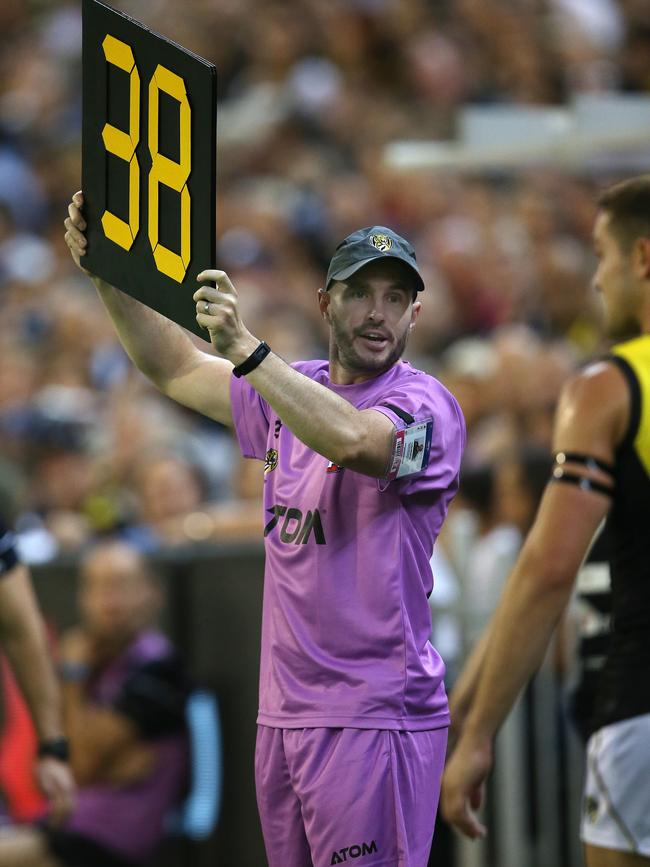 The Richmond runner tries to signal to Noah Balta. Picture: Michael Klein