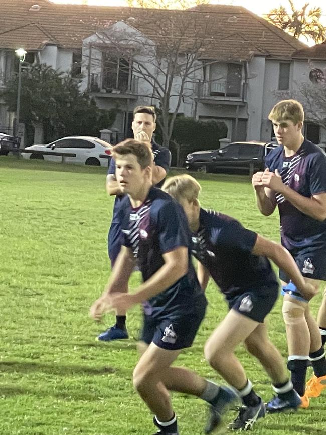 The Brisbane White under 16s warm up.