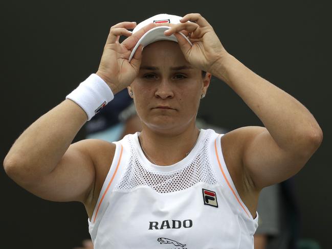 Australia's Ashleigh Barty adjusts her cap during a break in a women's singles match against United States' Alison Riske during day seven of the Wimbledon Tennis Championships in London, Monday, July 8, 2019. (AP Photo/Ben Curtis)