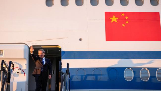 China's Premier, Li Qiang, waves as he arrives at Adelaide Airport. Picture: AFP