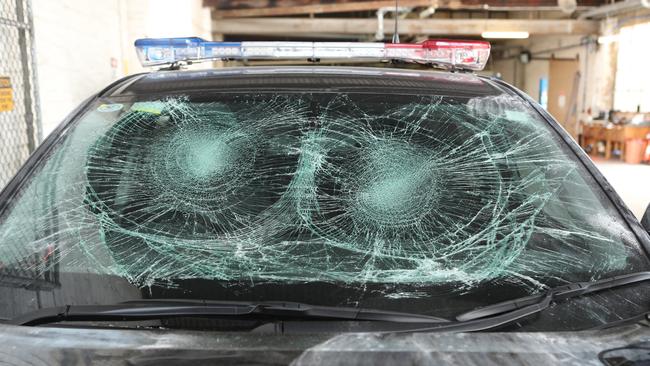 One of four police cars that were damaged when police tried to break up a party in North Melbourne. Picture: David Crosling