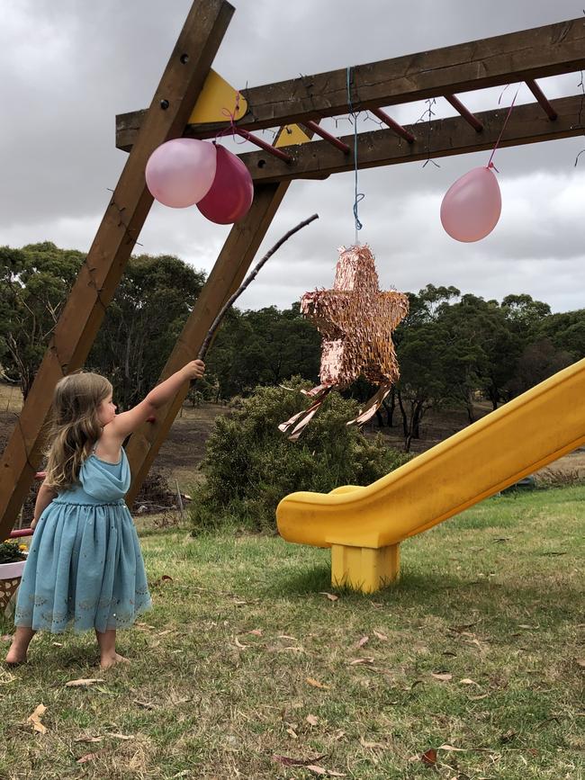 A special moment at the family birthday party thrown by Mel Myers in the park.