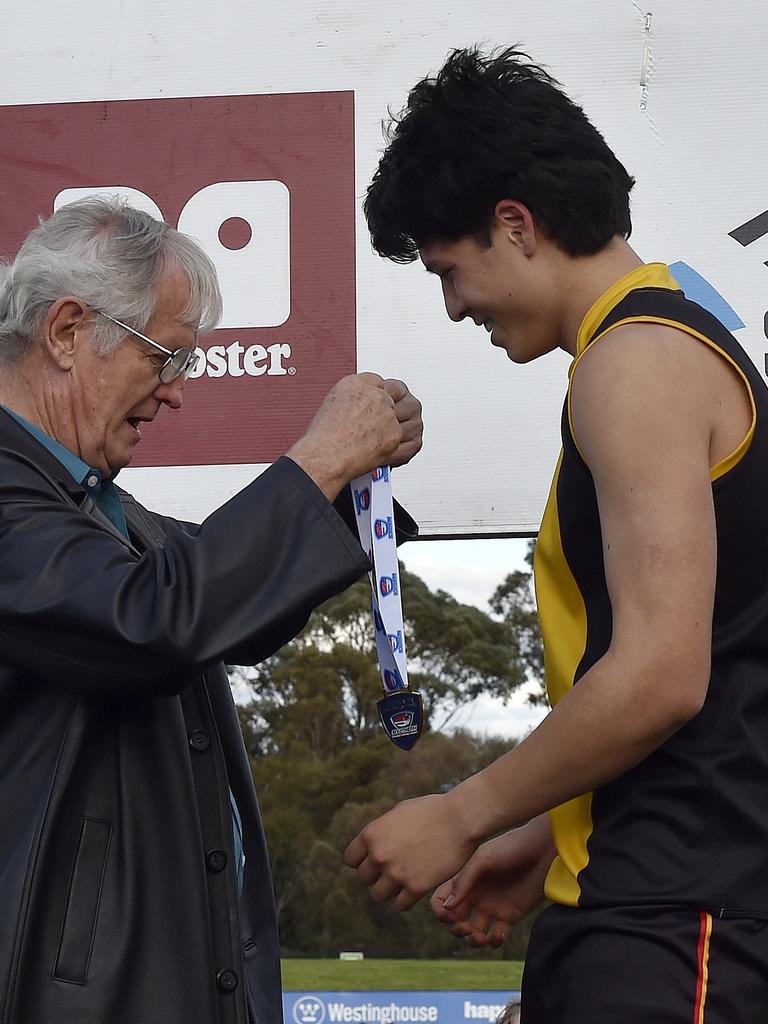 Josh Lai gets his premiership medal. Picture: Andrew Batsch