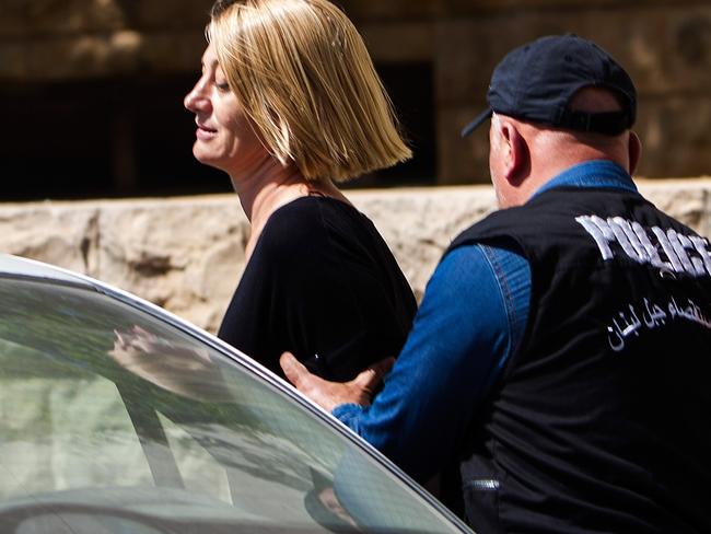 Tara Brown is escorted from court back to a cell where she will have to spend two more nights along with her fellow team members. Picture: Diego Ibarra Sanchez/Getty Images.