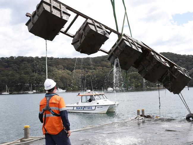 The recovery of building materials in Pittwater off Scotland Island. Photo Manly Daily