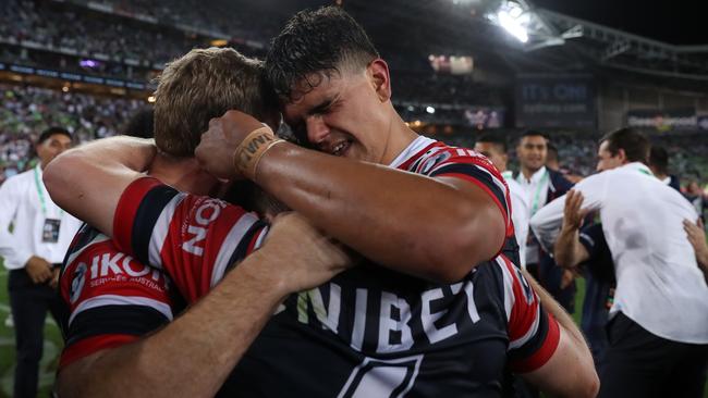 Seems like this was a farewell hug from Latrell Mitchell. Picture: Brett Costello