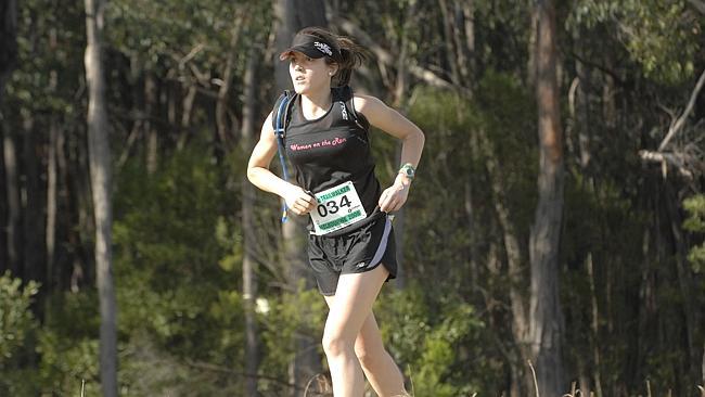  A competitor at the Oxfam trailwalk passes the Mt Evelyn checkpoint. 