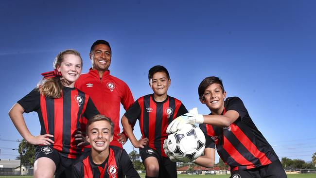 Cassio in 2017 created history when his academy team was the first from Australia to be invited to the world's biggest youth soccer tournament. Bernardo Oliveira (front), Sasha Coorey (left), Cassio, Jacob Jones and Zebaztian Newchurch. Picture Sarah Reed