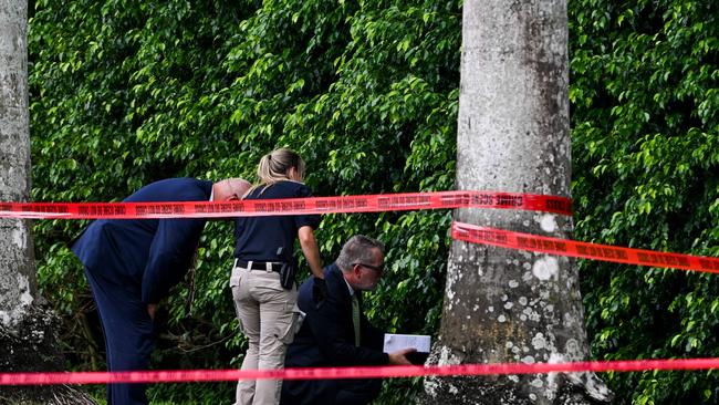 Investigators examine a crime scene outside the Trump International Golf Club following Sunday's attempted assassination. Picture: AFP