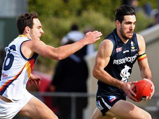 27/08/16 - SANFL: South Adelaide v Adelaide at Noarlunga Oval. South Adam Gulden takes on Crows Dylan Shoenmakers. Photo Tom Huntley