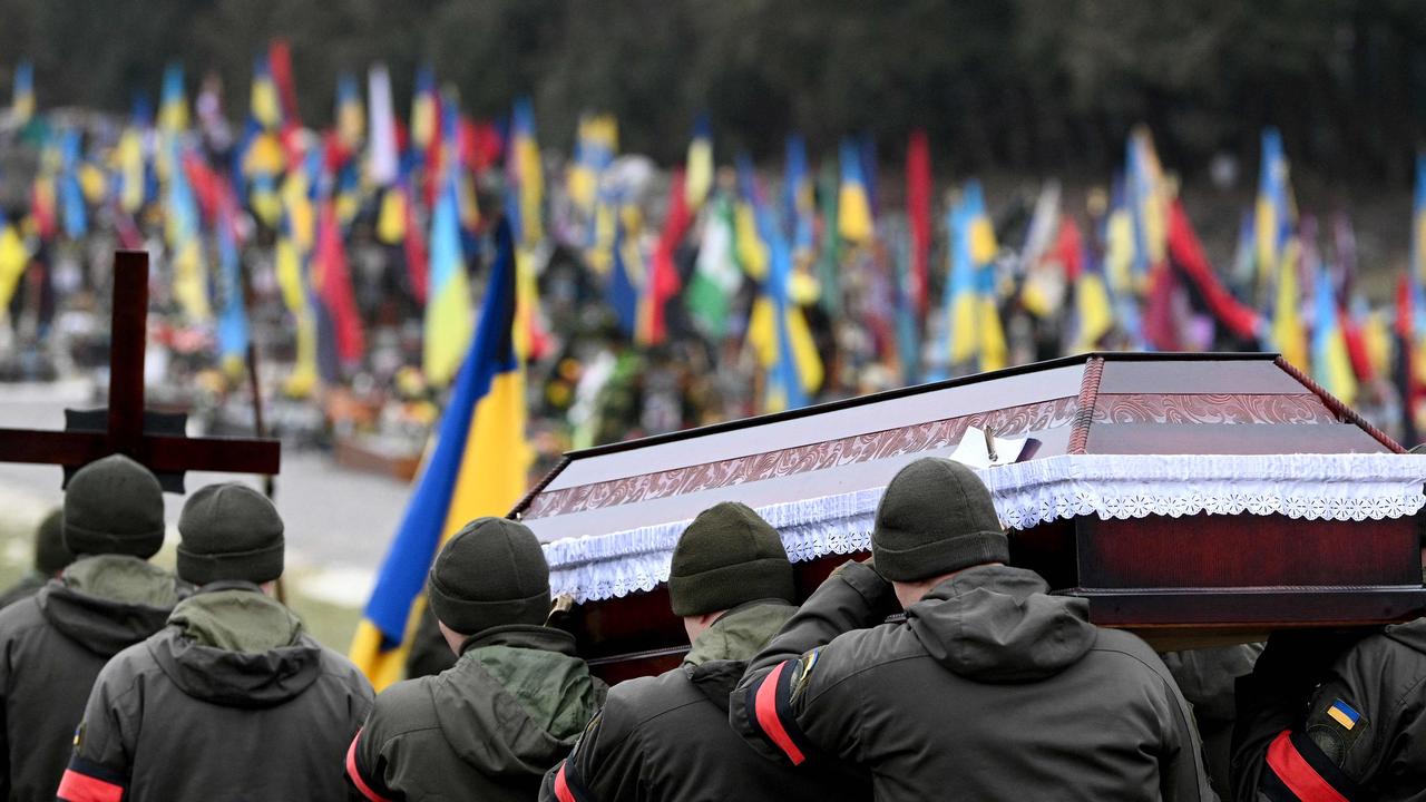 Ukrainian soldiers carry the coffin of their comrade Maryan Holovaty, killed in combat with Russian troops, during a funeral service in Lviv last week. Picture: Yuriy Dyachyshyn/AFP