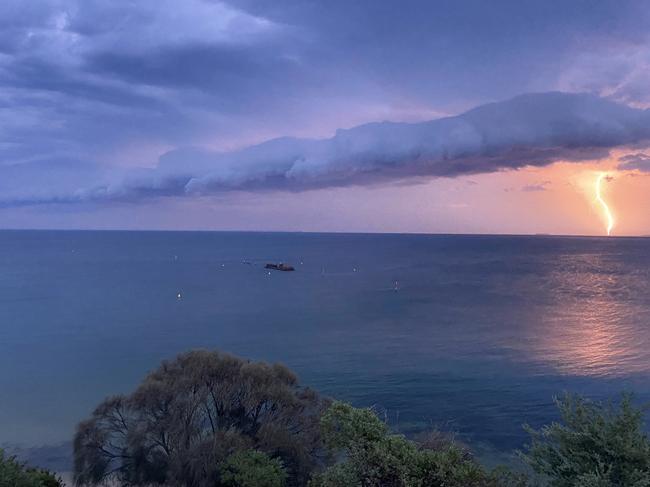 Lightning near Halfmoon bay during the summer storm that hit Melbourne on Thursday. Picture: Twitter @theredwren