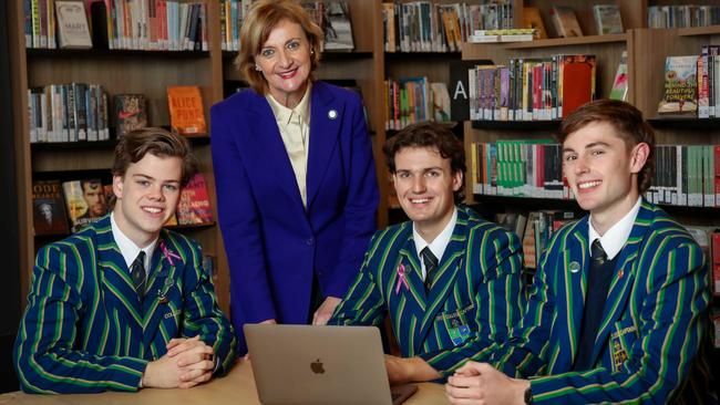 St Kevin's College is one of many boys’ schools continuing to grow. Pictured: Principal Deborah Barker with college captain Luke Lourey and deputy captains Thomas Hall and Conor Lynch. Picture: Ian Currie