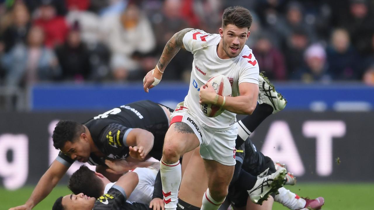 Oliver Gildart of England breaks away to score the winning try