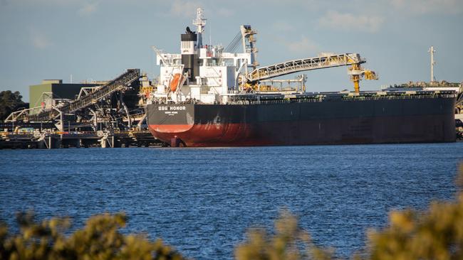 A coal ship is loaded at the Port of Newcastle. Australian banks have been limiting their exposure to the coal industry. Picture: Liam Driver