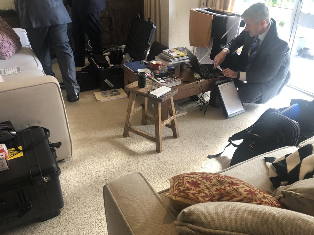 Federal Police going through Smethurst personal items at her Canberra home in June.