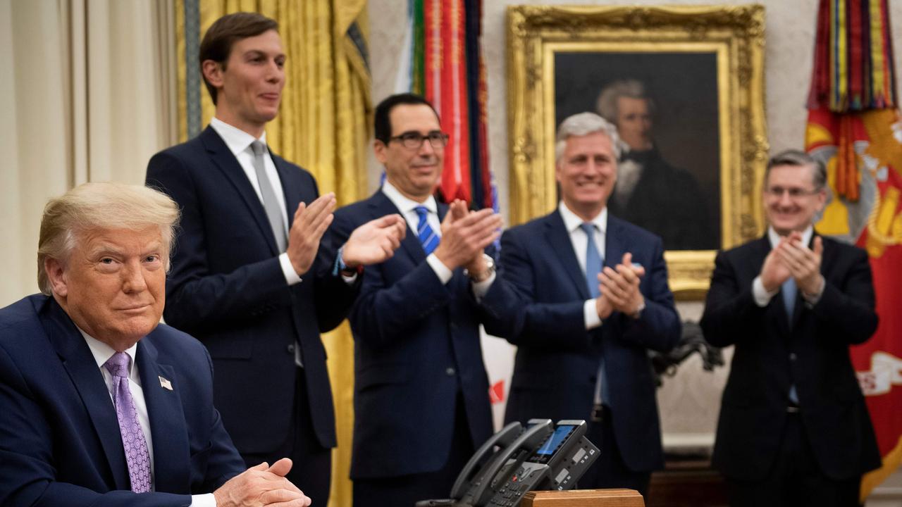 Senior adviser Jared Kushner, Treasury Secretary Steven Mnuchin and National Security Adviser Robert O’Brien with Donald Trump in August. Picture: Brendan Smialowski/AFP