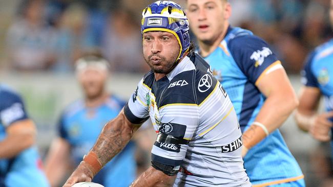 Johnathan Thurston of the Cowboys takes on the defence during the round four NRL match between the Gold Coast Titans and the North Queensland Cowboys at Cbus Super Stadium on March 25, 2017 in Gold Coast, Australia. (Photo by Bradley Kanaris/Getty Images)