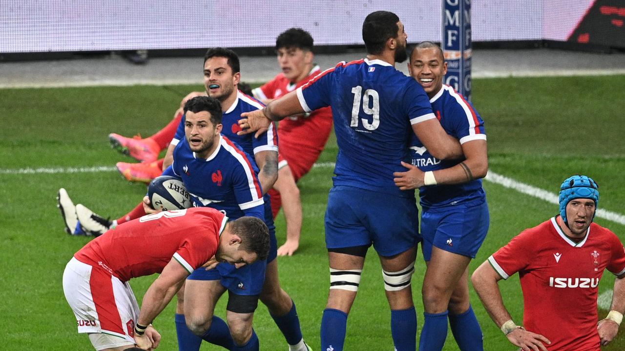 France's full-back Brice Dulin (L) celebrates after scoring the matchwinner against Wales at the Stade de France, Paris.