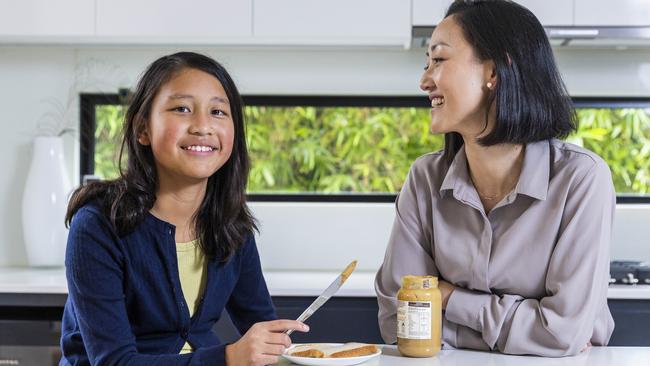 Ju Lee Ng with her daughter, Stella, who has been cured of her peanut allergy. Picture: Aaron Francis/The Australian
