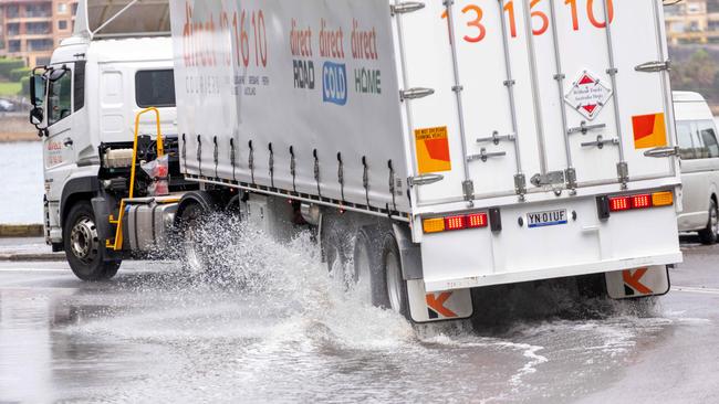 A truck drives through a puddle in the Sydney CBD. Picture: NCA NewsWire / Damian Shaw