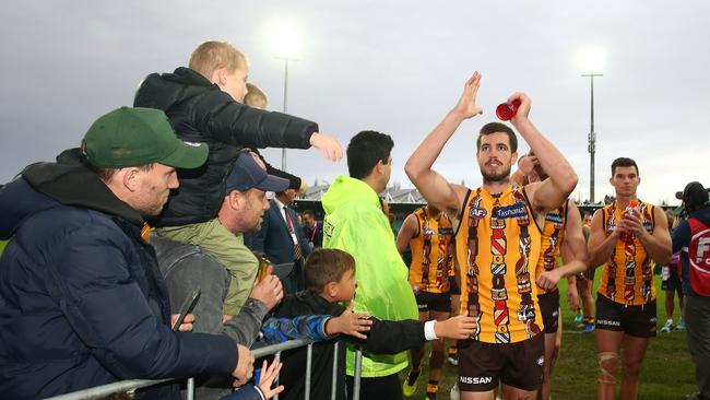 Ben Stratton leads Hawthorn off after its victory over Port Adelaide. Picture: Scott Barbour/Getty Images.