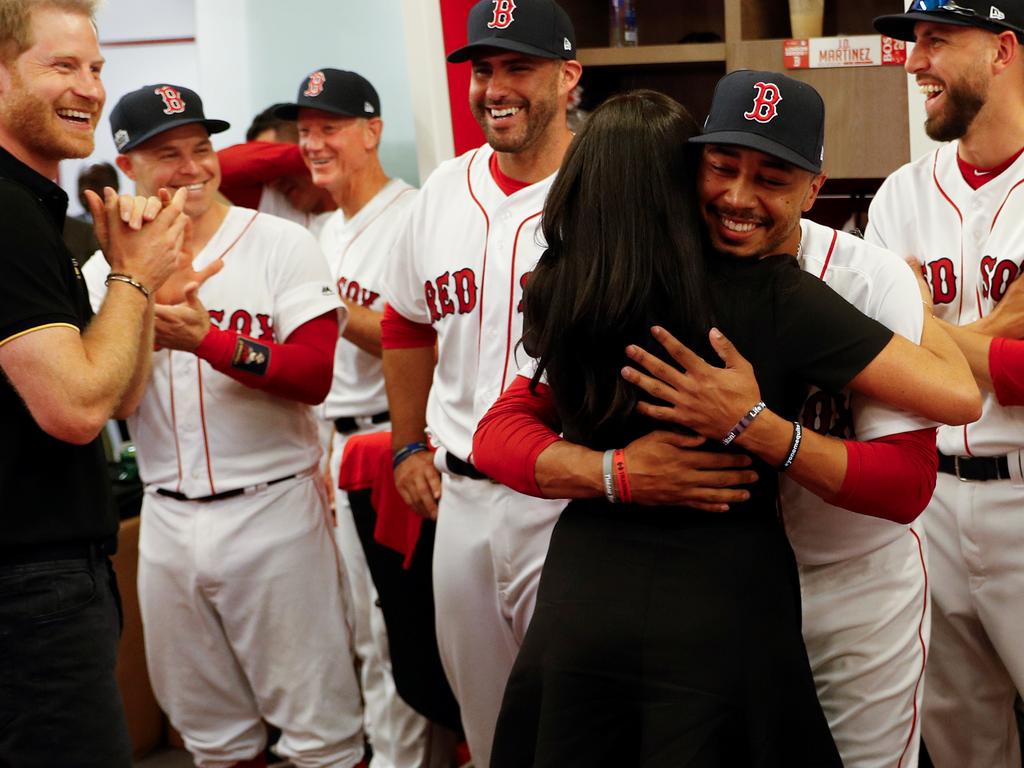 Royal watchers were stunned when Meghan gave Mookie Betts such a warm hug, but now we know why. Picture: Peter Nicholls/Pool