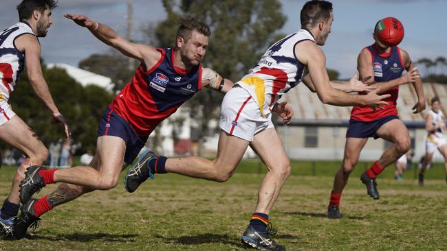 SFL: Chelsea Heights’ Jessie Odell can’t stop Jacob Buggy of Caulfield Bears. Picture: Valeriu Campan