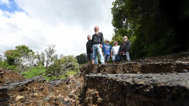 Concerned residents at Oakey Creek Road in July 2018, which is one of the many roads still needing repair after the 2017 floods. Picture: Marc Stapelberg